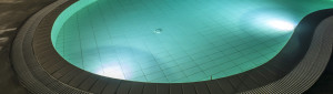 Tile swimming pool with night lights on